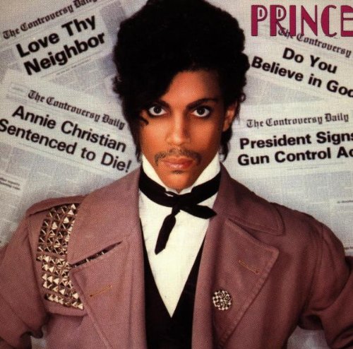Prince album cover featuring a man in a pink suit against a newspaper background.