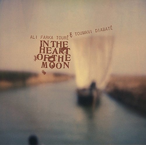 "Vinyl album cover with a boat on a river and brown text."