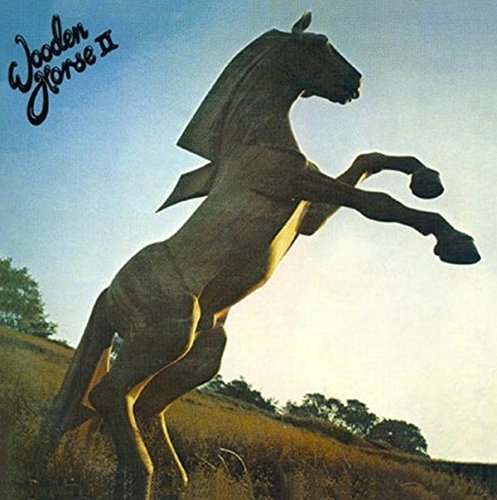 CD cover featuring a dark, abstract wooden horse rearing up.
