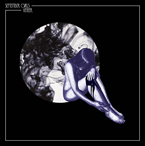 Blue-toned album cover with a figure and swirling smoke in a circle.