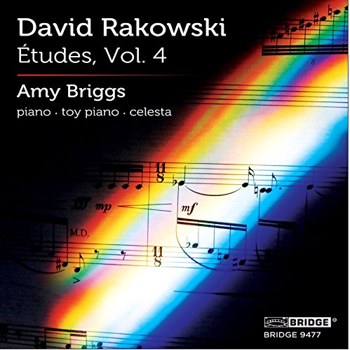 "Album cover with sheet music and rainbow beam on a black background."