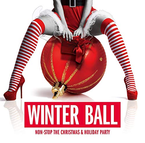 Person in striped stockings sitting on a large red Christmas ornament.