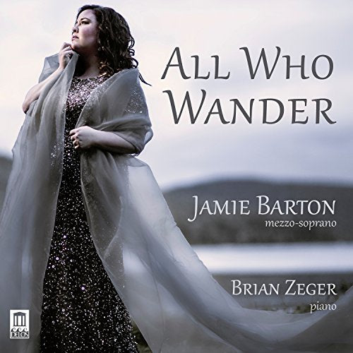 A woman in a sparkly dress and flowing grey shawl on a music album cover.