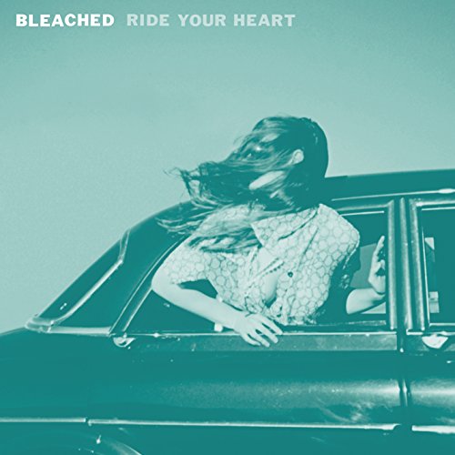 Bleached album cover: woman leaning from a car window, teal tint.