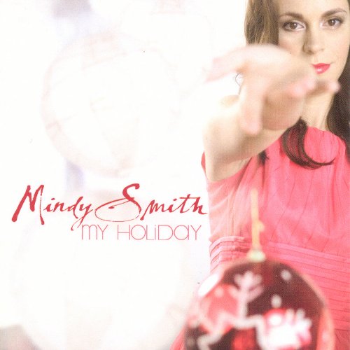 Woman in a pink dress holding a Christmas ornament, album cover for "My Holiday".