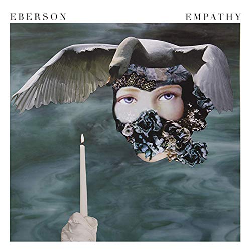 "Album cover with a face, swan wings, and a candle in water."