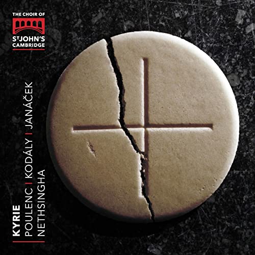 CD cover with a cracked stone disc featuring a cross symbol.