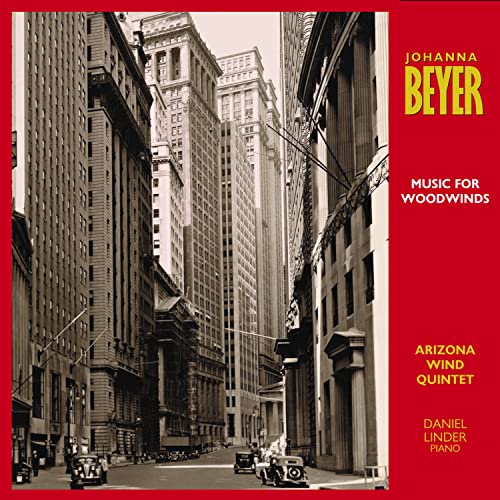 CD cover: Tall city buildings in grayscale, with yellow text.