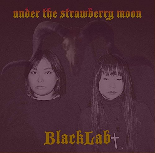 Purple-toned album cover featuring two women and a horned creature silhouette in background.