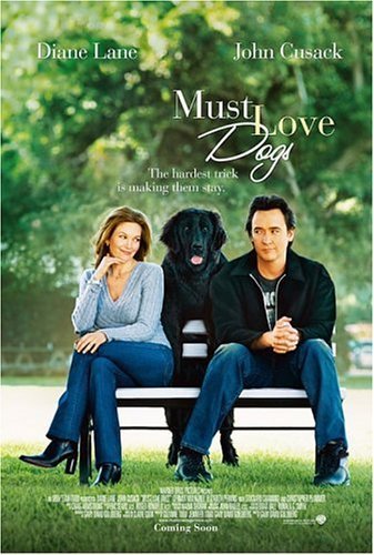 Diane Lane and John Cusack sit on a park bench with a black dog.