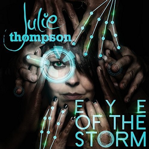 "Album cover with a woman's face surrounded by multiple hands and constellation graphics."