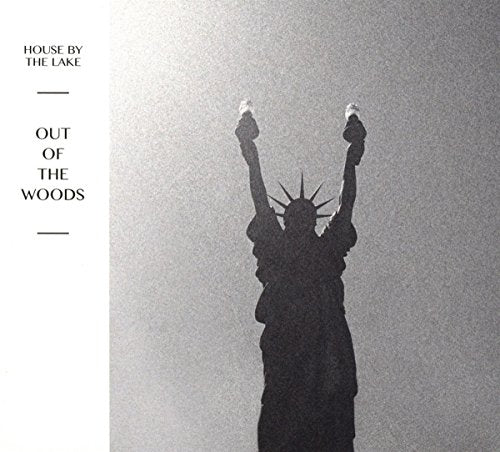 "Album cover featuring a silhouette of the Statue of Liberty against a grey background."