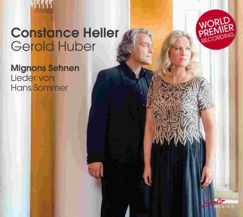 Man and woman standing together, looking off to the right, on a CD cover.