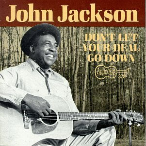 "CD cover with black and white photo of man playing guitar, text 'John Jackson'."