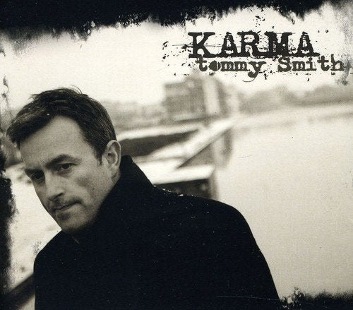 Album cover with a man in a black jacket and "Karma" text.