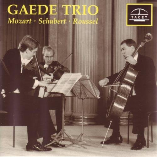 The image depicts a CD cover featuring three musicians playing string instruments. A suitable alt text for this image could be: "CD cover with three men playing violin, viola, and cello."
