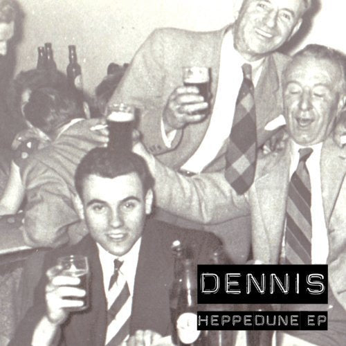 Black and white image of men in suits drinking and celebrating at a table.