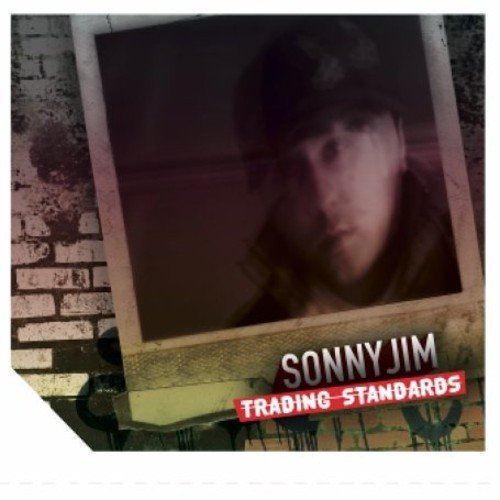 A Polaroid photo of a man, with "Sonny Jim Trading Standards" text below.