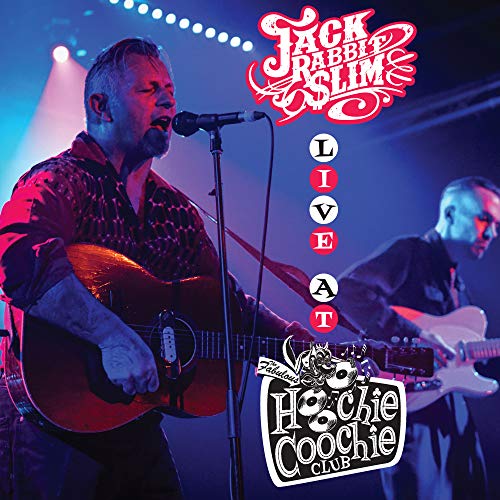 CD cover: singer with guitar performing live at a nightclub.
