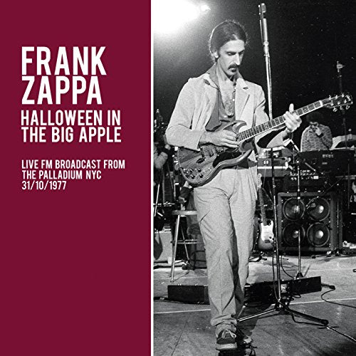 Frank Zappa playing guitar on stage, album cover for "Halloween in the Big Apple.