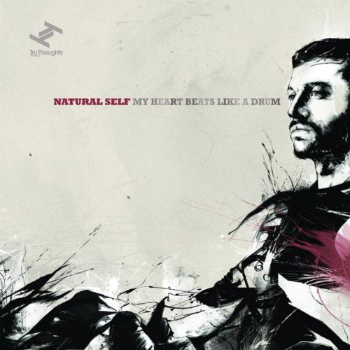 Album cover with a man's face and abstract design, text reads "Natural Self My Heart Beats Like A Drum".