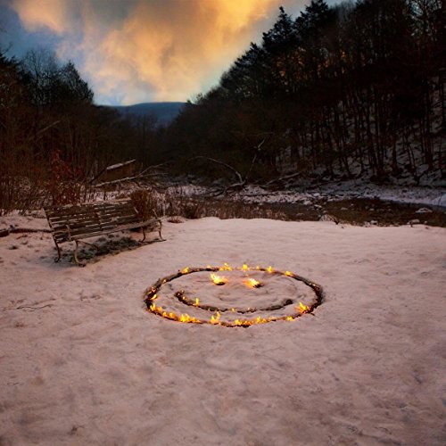 Vinyl album cover: snowy landscape with a fire-formed smiley face.