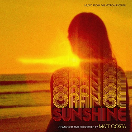 Orange vinyl record cover featuring a silhouetted figure at sunset.