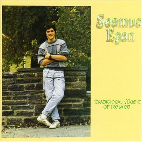 Album cover featuring a man holding a flute, standing by stone steps.
