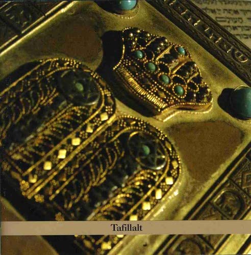 Golden filigree design with turquoise stones on a CD cover, “Tafillalt”.