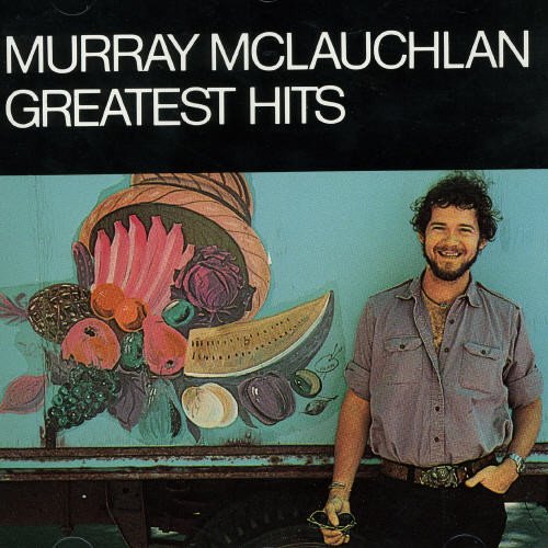 "CD cover with a man standing beside a painted fruit basket."