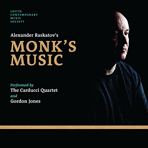 "CD cover with a bald man in dark clothing against a black background."