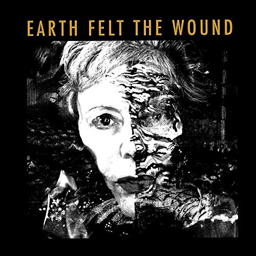 Album cover with a woman's face, half in black and white, on black background.