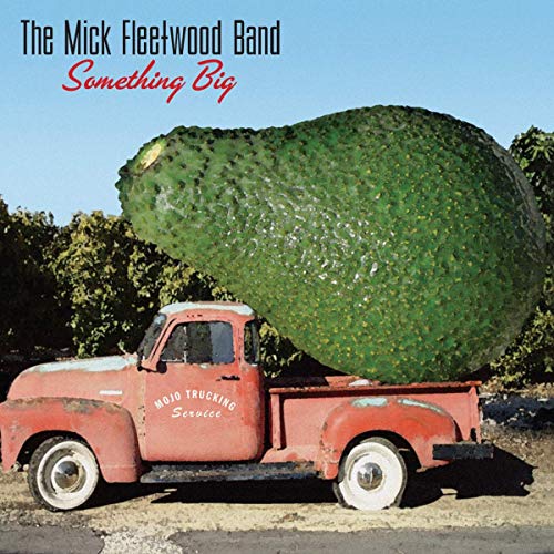 The image depicts the cover art for "The Mick Fleetwood Band" album "Something Big". Alt text: "Red truck carrying a large avocado on its flatbed, outdoors."