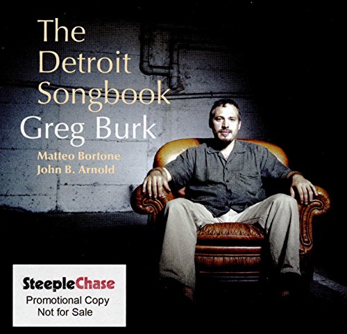 CD cover featuring a man sitting in an ornate chair with text overlay.