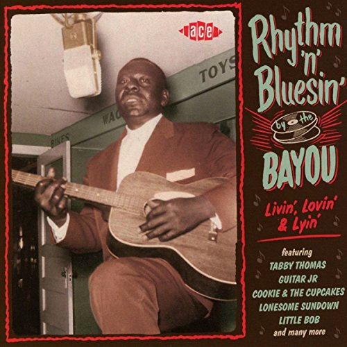 CD cover featuring a smiling Black musician at a microphone.