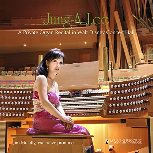 Jung-a Lee seated at a large pipe organ in Walt Disney Concert Hall.