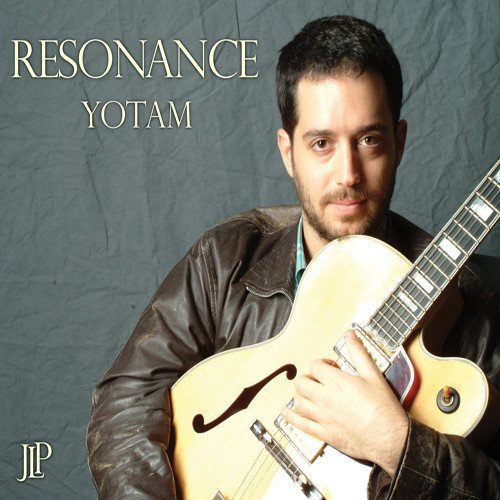 Man holding a guitar, album cover "Resonance" by Yotam, dark grey background.