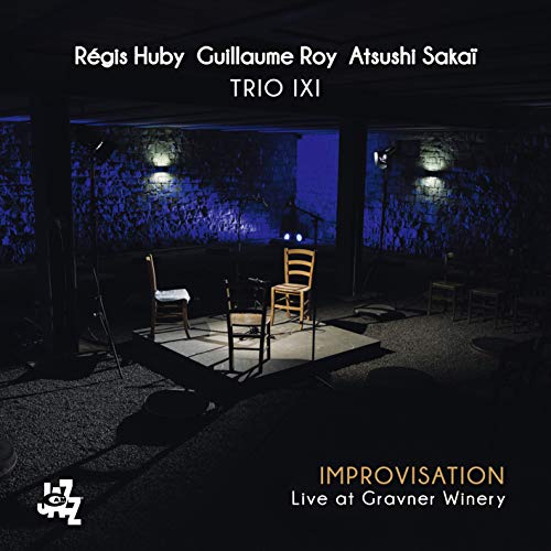 CD case for Trio Ixi’s live improvisation album, featuring winery imagery.