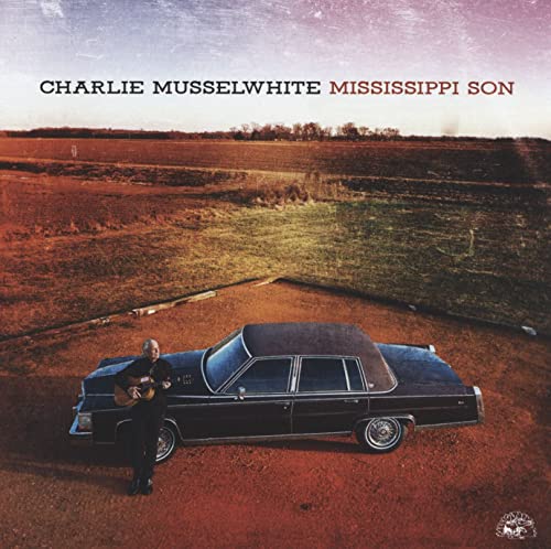 CD cover: musician with guitar and vintage car in a field.