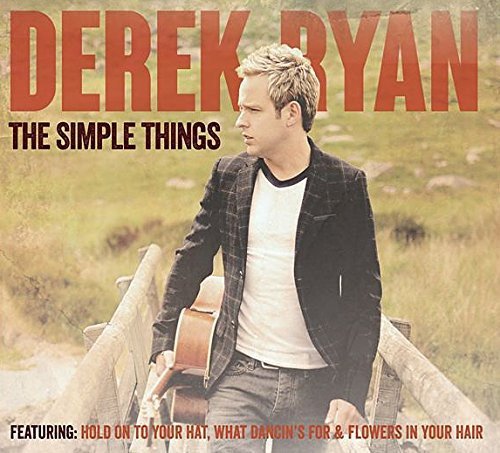 "Derek Ryan album cover with man holding guitar in a rural setting."