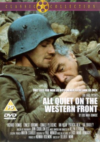 A soldier in a helmet holds an older man in a muddy trench.