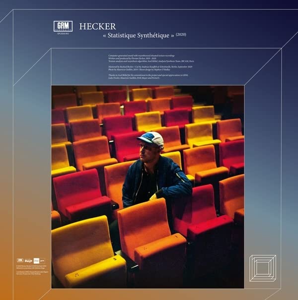 Album cover: a man sits alone in a large, empty yellow theater.