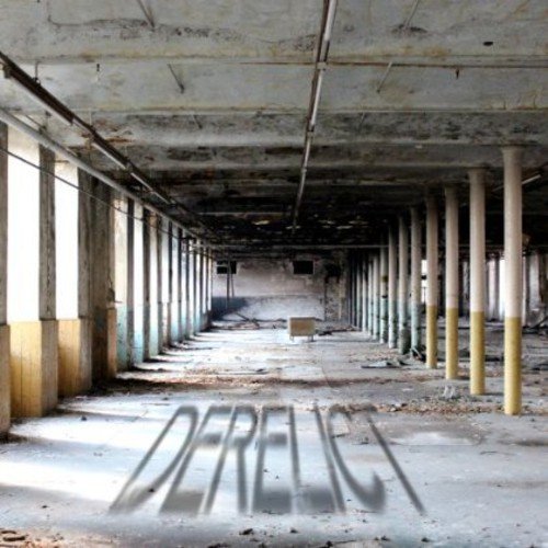 "Abandoned industrial building with graffiti 'derelict' on the floor, showing decay and neglect."