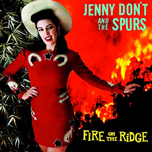 Album cover featuring a woman in a red western dress against a fire background.