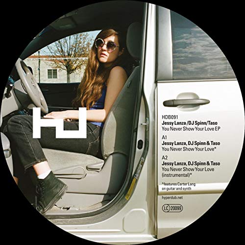 Vinyl record label with woman in a car, tracklist details visible.