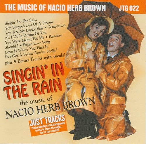 CD cover for “Singin’ in the Rain” featuring a couple under an umbrella.