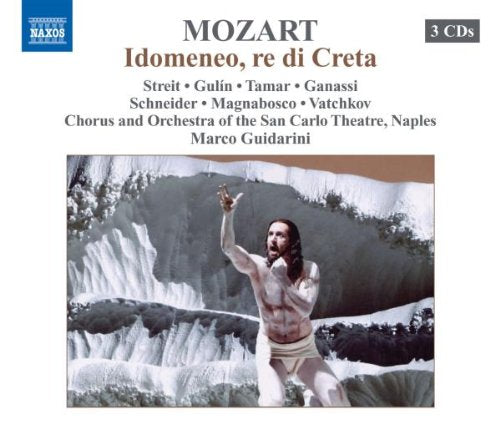 "CD cover featuring a man in a loincloth standing in front of a waterfall."