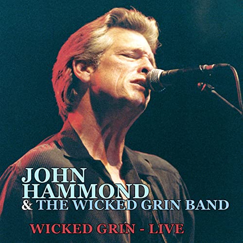 John Hammond singing into a microphone on a CD cover.