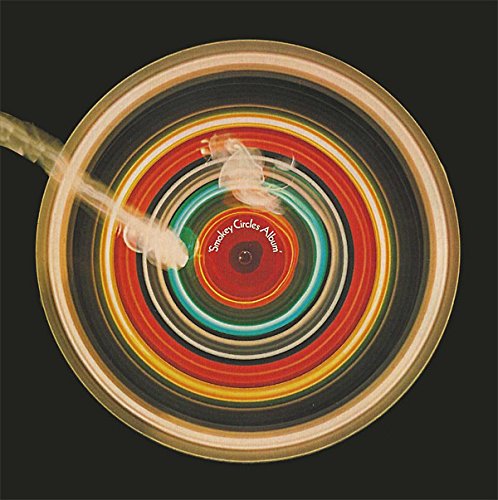 CD album cover with swirling red, green, and beige rings on a black background.