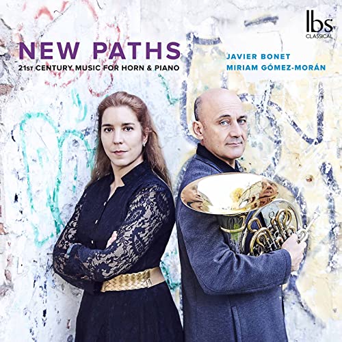 CD cover featuring two musicians and a French horn against a wall.